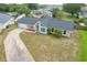 Aerial view of single-story home with driveway and landscaping at 340 Vail Dr, Winter Haven, FL 33884