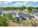 This beautiful home features a screened lanai, fenced yard, and lush green landscaping at 340 Vail Dr, Winter Haven, FL 33884