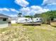 Wide backyard provides ample room for parking trailers and outdoor activities at 340 Vail Dr, Winter Haven, FL 33884
