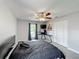 This bedroom includes neutral walls, carpet, ceiling fan, and a conveniently located desk area at 340 Vail Dr, Winter Haven, FL 33884