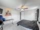 The bedroom showcases a ceiling fan, carpet, and adjacent closet for ample storage at 340 Vail Dr, Winter Haven, FL 33884