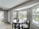 Charming breakfast nook with a round table, comfortable seating, and bright windows overlooking the backyard at 340 Vail Dr, Winter Haven, FL 33884