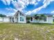 Charming single-story home with large windows, a gable roof and a well-manicured front lawn at 340 Vail Dr, Winter Haven, FL 33884