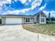 Charming single-story home with large windows, a gable roof and a well-manicured front lawn at 340 Vail Dr, Winter Haven, FL 33884