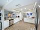 Spacious kitchen with stainless steel appliances, granite countertops, an island, and an open layout at 340 Vail Dr, Winter Haven, FL 33884