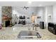 Open concept kitchen featuring stainless steel sink, stone countertops, and a view into the living room at 340 Vail Dr, Winter Haven, FL 33884