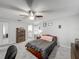 Inviting bedroom featuring neutral colors, a ceiling fan, and an ensuite bathroom at 340 Vail Dr, Winter Haven, FL 33884