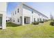 Spacious backyard with lush green grass, perfect for outdoor activities and relaxation at 3470 Beau Rd, Kissimmee, FL 34746