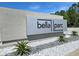 Landscaped entrance to Bella Parc community with decorative rocks and native plants at 3470 Beau Rd, Kissimmee, FL 34746