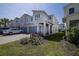 Charming townhome exterior with well-maintained landscaping, inviting curb appeal at 3470 Beau Rd, Kissimmee, FL 34746
