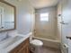 Well-maintained bathroom with wood vanity and ample counter space for convenience at 36 Inconnu Dr, Poinciana, FL 34759