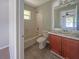 Cozy bathroom features a vanity with wood cabinets and a tub-shower combination at 36 Inconnu Dr, Poinciana, FL 34759