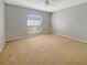 Bedroom featuring a large window that offers nice outdoor views and fills the space with light at 36 Inconnu Dr, Poinciana, FL 34759
