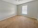 Bright bedroom with a ceiling fan and window allowing for ample natural light at 36 Inconnu Dr, Poinciana, FL 34759