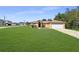 Inviting single-Gathering home featuring a spacious front lawn, attached two-car garage and tidy landscaping at 36 Inconnu Dr, Poinciana, FL 34759