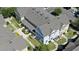 Overhead view of colorful townhouses, showcasing well-maintained lawns and community landscaping at 4004 Santa Maria Dr # 108, Kissimmee, FL 34741