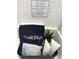 Bathroom amenities basket with black towel labeled makeup, and soaps at 4004 Santa Maria Dr # 108, Kissimmee, FL 34741