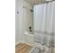 Clean bathroom featuring a shower-tub combo with white tile and a patterned shower curtain at 4004 Santa Maria Dr # 108, Kissimmee, FL 34741