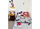 bedroom with Mickey Mouse themed beddings and decorations at 4004 Santa Maria Dr # 108, Kissimmee, FL 34741