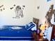 Star Wars themed bedroom features a bed with themed bedding and decor, creating a fun space at 4004 Santa Maria Dr # 108, Kissimmee, FL 34741