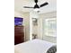 Cozy bedroom featuring a dresser, closet, and window with natural light at 4004 Santa Maria Dr # 108, Kissimmee, FL 34741