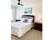 Bright bedroom with a comfortable bed, matching nightstands, and elegant lamps at 4004 Santa Maria Dr # 108, Kissimmee, FL 34741