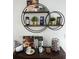Charming coffee station with decorative shelves, a coffee maker, and coffee-themed decor at 4004 Santa Maria Dr # 108, Kissimmee, FL 34741