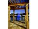 Night view of a tranquil water fountain surrounded by charming homes, seen from under a wooden structure at 4004 Santa Maria Dr # 108, Kissimmee, FL 34741
