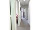 Hallway with carpet flooring leading to bedrooms and other areas of the house at 4004 Santa Maria Dr # 108, Kissimmee, FL 34741