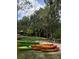 Kayaks on the shore, surrounded by lush trees, offer outdoor recreation at 4004 Santa Maria Dr # 108, Kissimmee, FL 34741