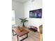 Comfortable living room with modern furniture, a large screen TV, and a stylish coffee table at 4004 Santa Maria Dr # 108, Kissimmee, FL 34741