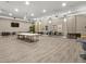 Spacious and well-lit meeting room with a long table, chairs, and a large TV for presentations at 4004 Santa Maria Dr # 108, Kissimmee, FL 34741