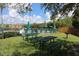Community picnic area with picnic tables and a grill near the pool, perfect for outdoor gatherings at 4004 Santa Maria Dr # 108, Kissimmee, FL 34741
