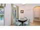 Charming dining area with a view of the pool, plus stylish table and seating at 4072 Oaktree Dr, Davenport, FL 33837