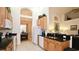 Well-lit kitchen with granite countertops and a seamless flow to the dining area and living room at 4072 Oaktree Dr, Davenport, FL 33837