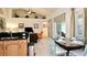 Open-concept kitchen with adjacent dining and living areas, perfect for entertaining at 4072 Oaktree Dr, Davenport, FL 33837