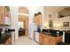 Beautiful kitchen featuring a breakfast bar, granite countertops and stainless steel sink at 4072 Oaktree Dr, Davenport, FL 33837