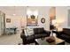 Comfortable living room with tile flooring, neutral walls, and seamless flow to dining area at 4072 Oaktree Dr, Davenport, FL 33837