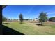Expansive backyard overlooking a serene pond and neighboring homes, offering a peaceful retreat at 4147 Sherlock Ct, Orlando, FL 32824