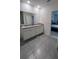 Bathroom with double vanity sinks and a gray granite countertop at 4147 Sherlock Ct, Orlando, FL 32824