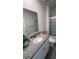 Bathroom featuring granite vanity, updated fixtures, and a shower at 4147 Sherlock Ct, Orlando, FL 32824