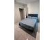 This bedroom features marble floors, a closet, a queen bed, and minimal decor at 4147 Sherlock Ct, Orlando, FL 32824
