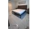 Bedroom with marble floors, a modern platform bed, and decorative touches at 4147 Sherlock Ct, Orlando, FL 32824