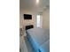 This bedroom features marble floors, a TV, a closet, and a bed at 4147 Sherlock Ct, Orlando, FL 32824