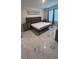 Bright bedroom with large windows, a platform bed, and stylish decor at 4147 Sherlock Ct, Orlando, FL 32824