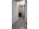 A bright closet with a wire shelf and a checkered garbage can on the floor at 4147 Sherlock Ct, Orlando, FL 32824
