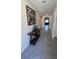Elegant foyer with art piece, table and tiled flooring at 4147 Sherlock Ct, Orlando, FL 32824