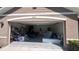 Attached garage filled with boxes, furniture, and other items at 4147 Sherlock Ct, Orlando, FL 32824