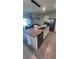 Kitchen island featuring a granite countertop and stainless-steel appliances at 4147 Sherlock Ct, Orlando, FL 32824