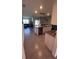 Open concept kitchen features stainless steel appliances, granite countertops, and large island at 4147 Sherlock Ct, Orlando, FL 32824